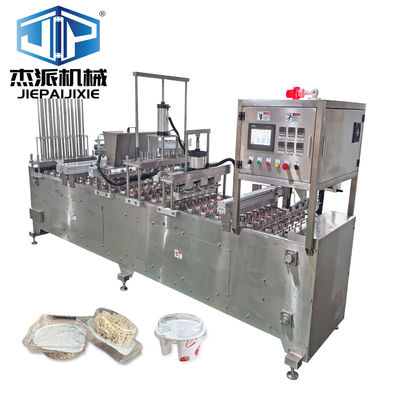 Macchina automatica per riempire e sigillare tazze a granuli per coperture di tazze di avena